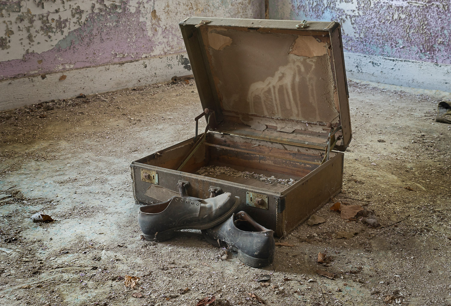An old briefcase and shoes left behind at an old Ohio poorhouse.