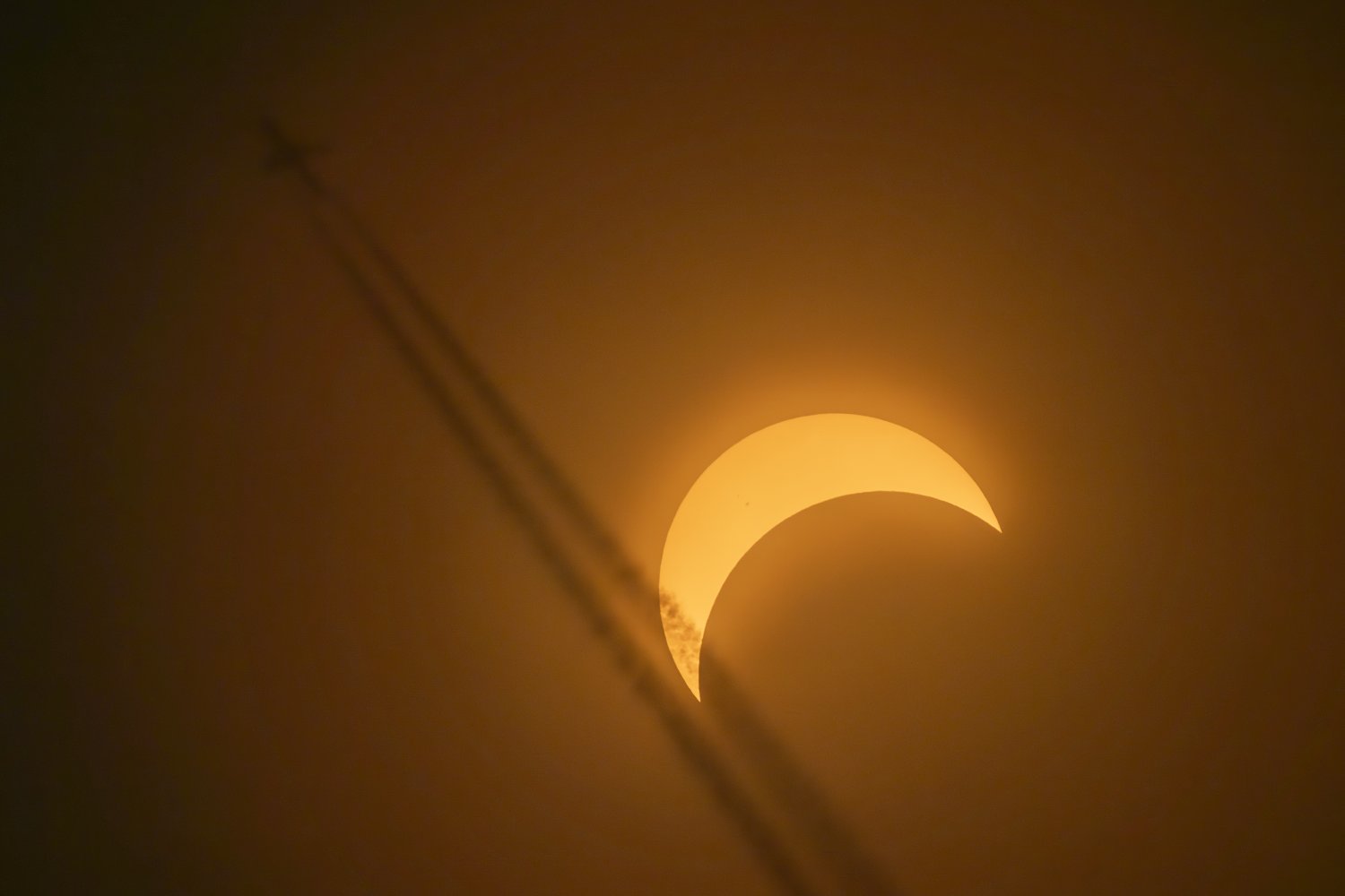 A Plane Flies by during Partial Eclipse