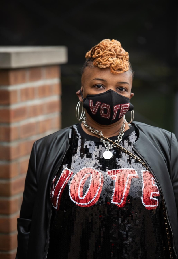 Tyra Henderson, of Cleveland, waits in line for early voting at the Cuyahoga County Board of Elections on October 30, 2020.