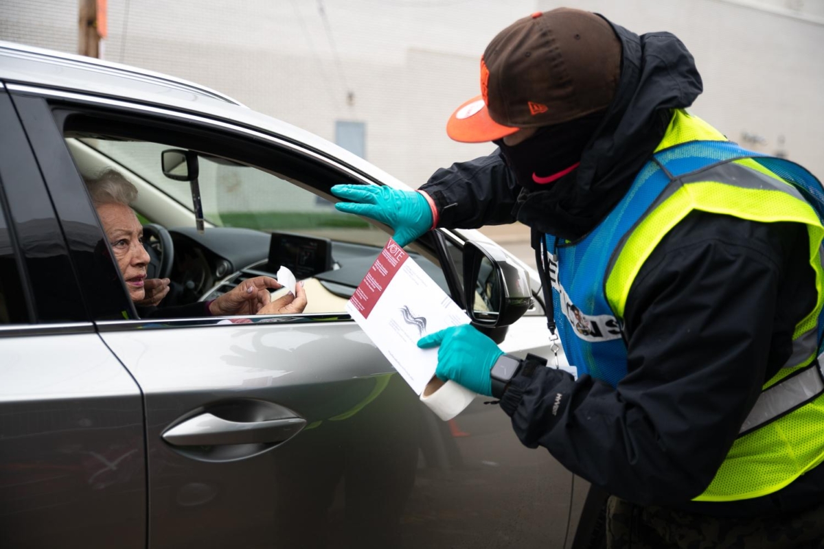 Voters drop off their absentee ballots at the Cuyahoga County Board of Elections on November 1, 2020 in Cleveland, Ohio.